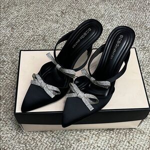 BCBGeneration women’s Bardia court Black Heels with Silver Bow Detail